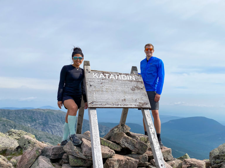 Hikers with the Katahdin trail sign